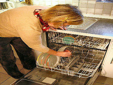 woman loading a dishwasher
