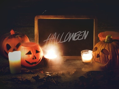 spooky Halloween chalkboard surrounded with pumpkins