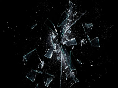 broken shards of glass in front of black background