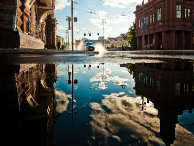 flooded streets with car in the background