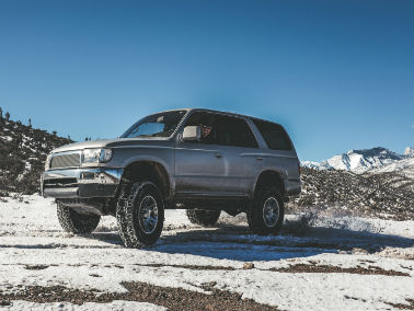 silver vehicle on a snowy mountain