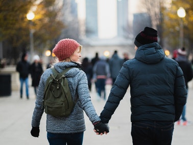 couple holding hands in winter