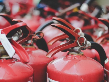 close up of group of fire extinguishers