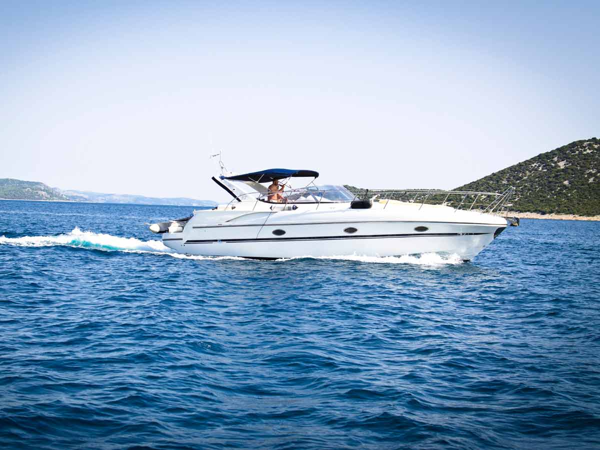 white speedboat on water