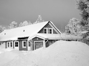 Home covered with snow