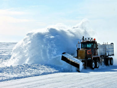 snowplow clearing snow away