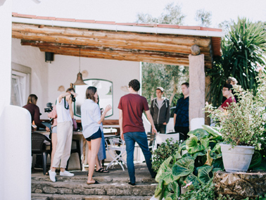 group of people gathered on a patio deck