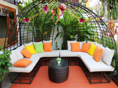 outdoor seating with bright pillows