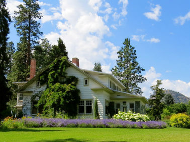 home exterior surrounded by flowers